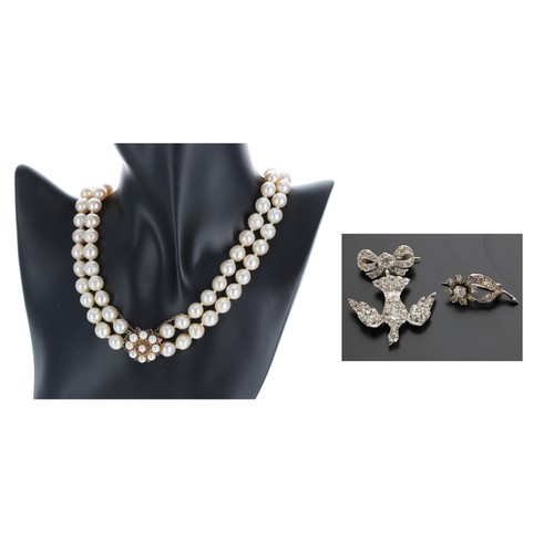 117 - Cultured pearl double strand necklace with a 9ct gem set clasp, the pearls 9mm approx, with safety c... 