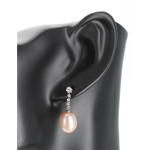 145 - Pair of attractive modern white old drop earrings, with peach /pink lustre pearls with a diamond set... 