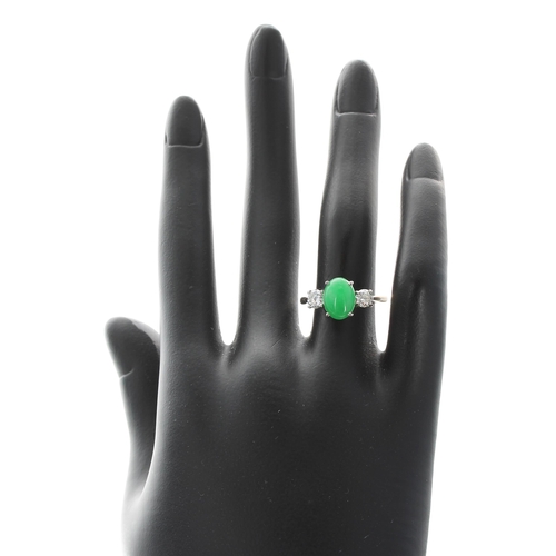 230 - 18ct white gold cabouchon jade and diamond three stone ring, the jade 2.20ct approx, with two round ... 