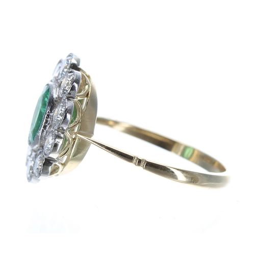 120 - Attractive 18ct and platinum emerald and diamond cluster ring, the emerald 0.90ct in a setting of te... 