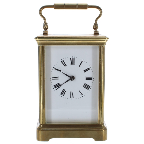 571 - Carriage clock timepiece striking on a gong, within a corniche brass case, 6