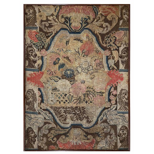 625 - Interesting needlework upholstered panel, decorated with flowers within a border of foliate scroll p... 