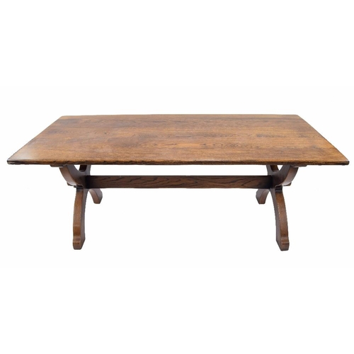 907 - Good large oak refectory table, the plank top on two X-shaped supports untied by a single long stret... 