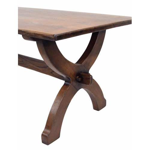 907 - Good large oak refectory table, the plank top on two X-shaped supports untied by a single long stret... 