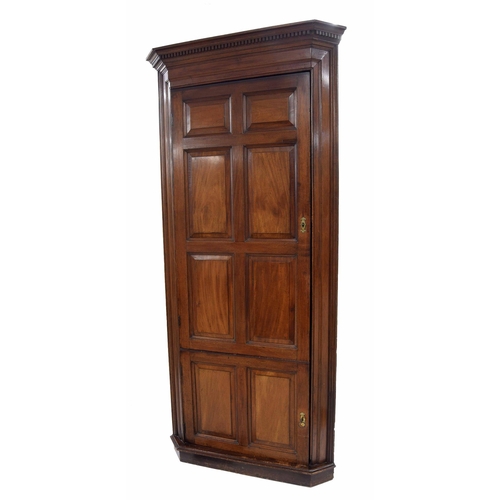 908 - Tall 19th century mahogany standing corner cupboard, with a carved dentil cornice over a long and sh... 