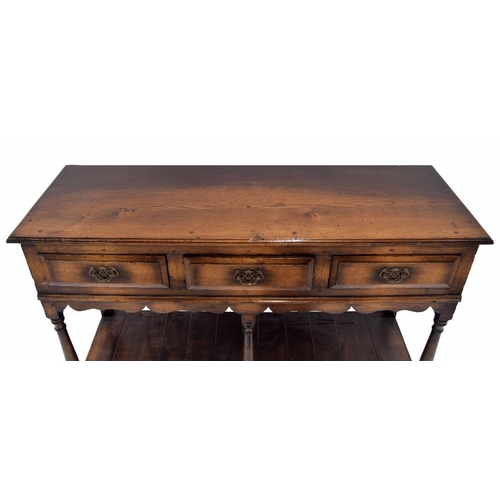 942 - Georgian style oak dresser base, with moulded top over three short drawers over shaped frieze raised... 