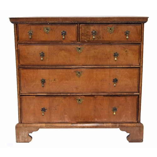 922 - 18th century walnut chest of drawers, the cross banded top over two short and three long graduated d... 