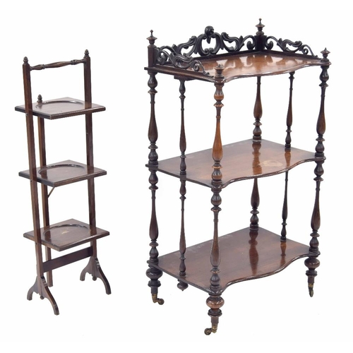 856 - Victorian serpentine rosewood three tier whatnot, with carved scroll gallery rail and turned pillar ... 