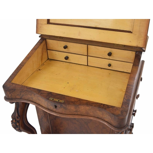 883 - Victorian figured walnut davenport, with raised back and hinged cover enclosing a fitted stationery ... 