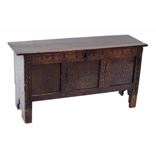 937 - Small antique oak triple panel coffer, the hinged cover enclosing an open interior over a roundel ca... 