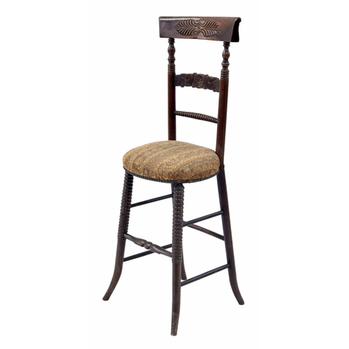 926 - Victorian child's correction chair, the carved bar back on turned supports over a stuff over upholst... 