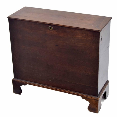 875 - Georgian mahogany slender box, the hinged cover enclosing an open interior, raised on bracket feet, ... 