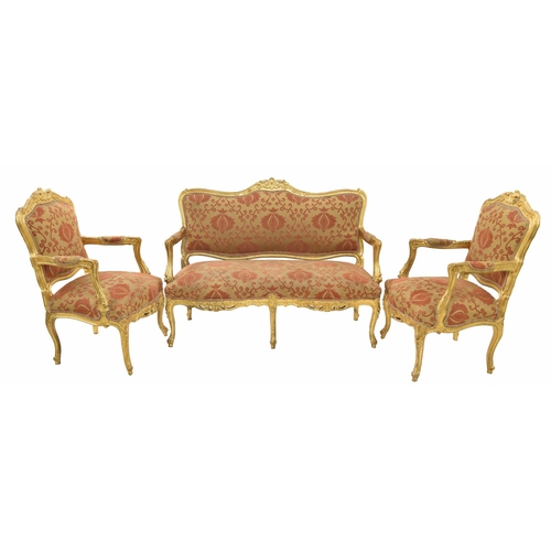 949 - Decorative French gilt suite comprising a settee and a pair of armchairs, the scrolling carved frame... 