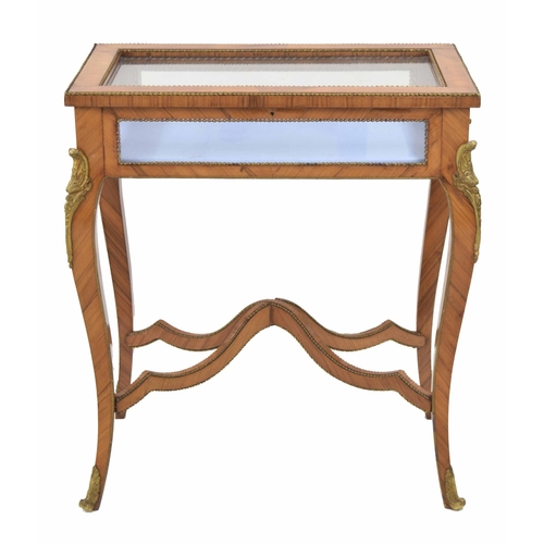 944 - French kingwood bijouterie display table, the glazed hinged cover enclosing a cushioned interior wit... 