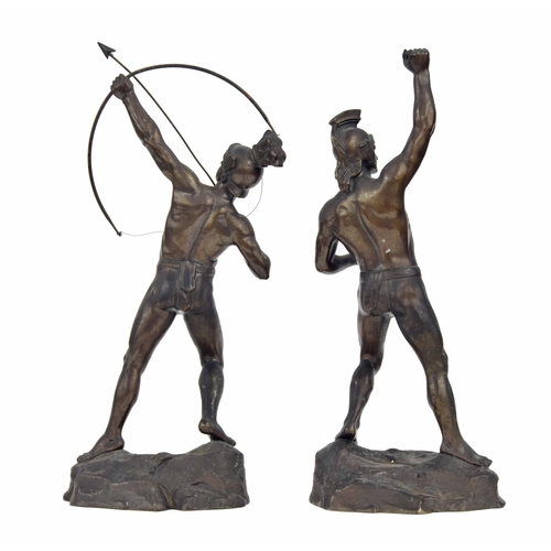 589 - Two spelter figures of Roman gladiators, one an archer, modelled on naturalistic rocky bases, talles... 