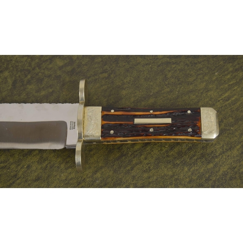 612 - Stan Shaw Bowie knife, with horn scales, engraved bolsters and worked blade back and handle edges, t... 