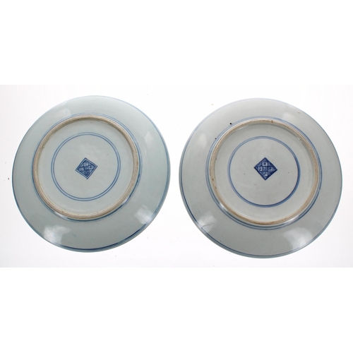 696 - Pair of Chinese blue and white porcelain dishes, the first decorated with a ribbon tied bouquet with... 