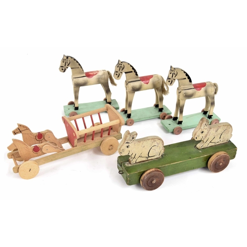 619 - A selection of rolling treen animal toys, animated rabbits, horse & cart and three horses 8