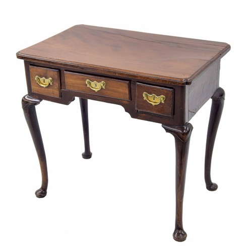 920 - George III mahogany low boy, the moulded top over three short drawers and a shaped frieze raised on ... 