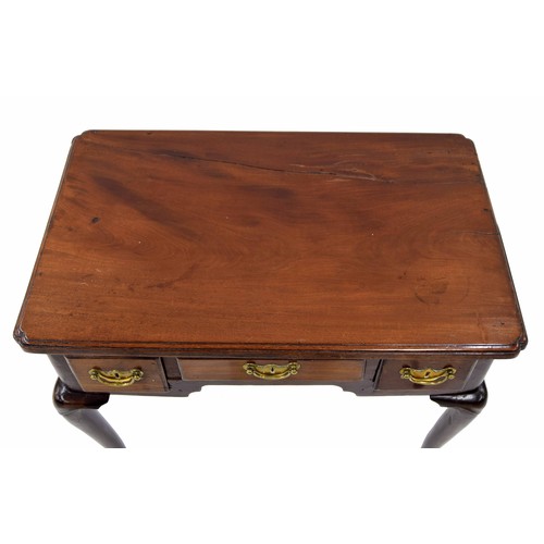 920 - George III mahogany low boy, the moulded top over three short drawers and a shaped frieze raised on ... 