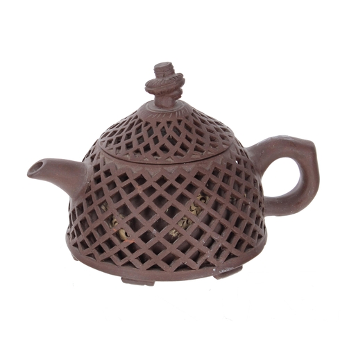 703 - Chinese Yixing clay teapot, the outer reticulated body, with fish decoration behind, makers stamp to... 