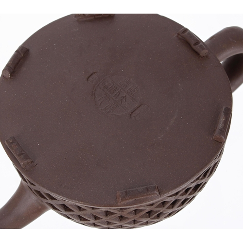 703 - Chinese Yixing clay teapot, the outer reticulated body, with fish decoration behind, makers stamp to... 