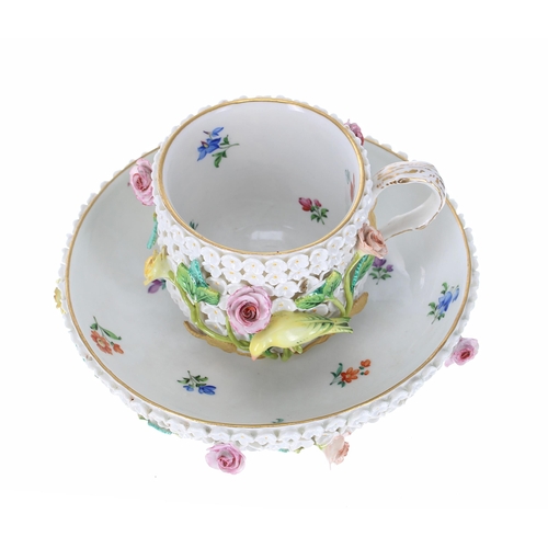 655 - Meissen porcelain Schneeball (snowball) cup and saucer, with a floral encrusted ground and applied b... 