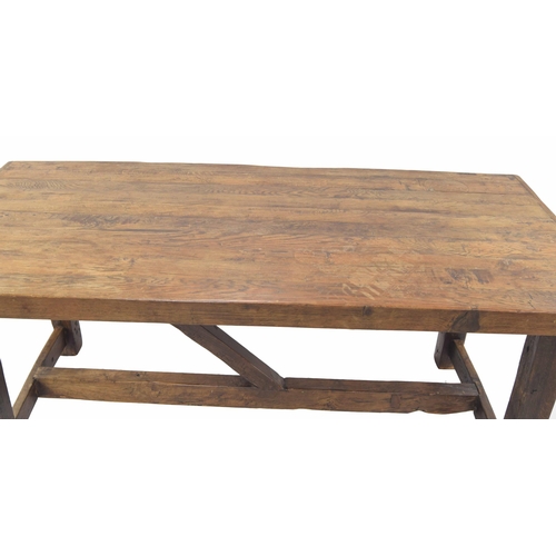 945 - Good French heavy rustic fruitwood refectory table, the cleated plank top over square supports unite... 