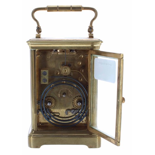 571 - Carriage clock timepiece striking on a gong, within a corniche brass case, 6