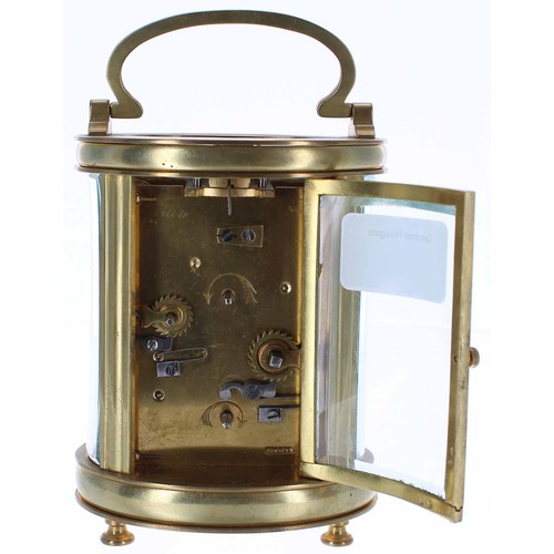 574 - French carriage clock timepiece with alarm sounding on a bell beneath the base, within an oval brass... 