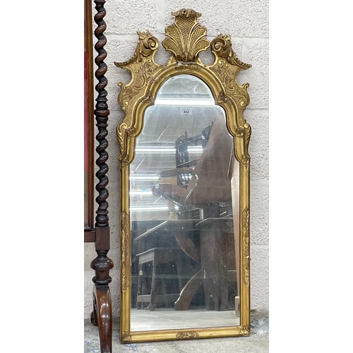 852 - 19th century gilt framed pier glass mirror, the arched glass within a git frame surmounted by a carv... 