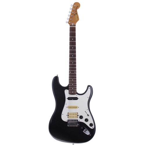 138 - Sunn by Fender Musical Instrument Corporation Mustang electric guitar; Body: black sparkle finish, a... 