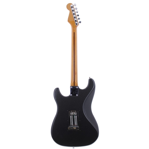 138 - Sunn by Fender Musical Instrument Corporation Mustang electric guitar; Body: black sparkle finish, a... 