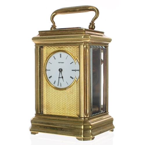 1306 - Tiffany of London miniature brass carriage clock timepiece with eight day movement, the white enamel... 