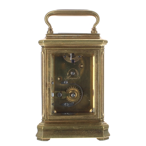 1306 - Tiffany of London miniature brass carriage clock timepiece with eight day movement, the white enamel... 