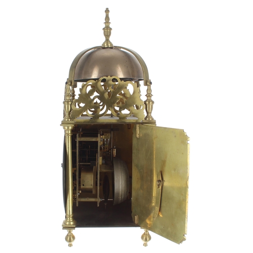 1375 - Brass lantern clock, the eight day ting-tang quarter strike on two bells and the movement back plate... 