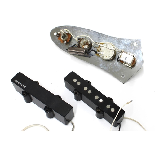 1144 - Jazz Bass loaded guitar control plate with push-pull volume and central CTS tone; together with two ... 