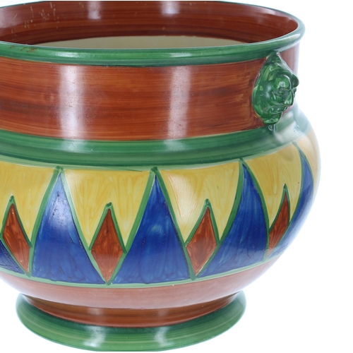 561 - Clarice Cliff 'Original Bizarre' jardinière, with two mask handles and painted with geometrics, pain... 