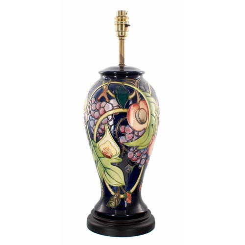 572 - Moorcroft Pottery 'Queens Choice' table lamp, an Emma Bossons design, mounted upon a turned base lab... 