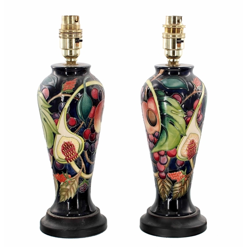 573 - Good pair of Moorcroft Pottery 'Queens Choice' table lamps designed by Emma Bossons, mounted upon tu... 