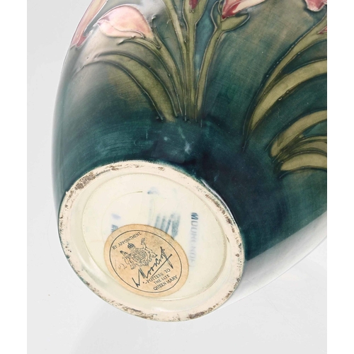 583 - Moorcroft Pottery 'African Lily' baluster vase, with factory stamp, signature and Royal Appointment ... 