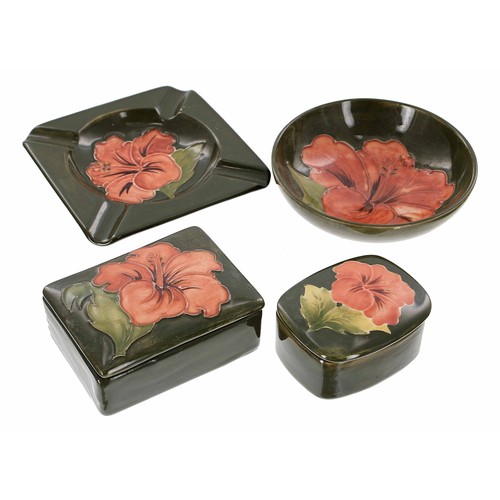 599 - Four pieces of Moorcroft Pottery 'Coral Hibiscus' pottery, to include a square ash tray, 4.5