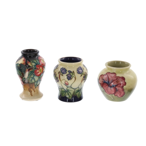 612 - Three miniature Moorcroft Pottery vases, including a 'Hepatica' vase designed by Emma Bossons, a kin... 