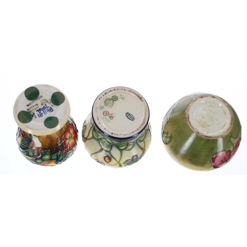 612 - Three miniature Moorcroft Pottery vases, including a 'Hepatica' vase designed by Emma Bossons, a kin... 