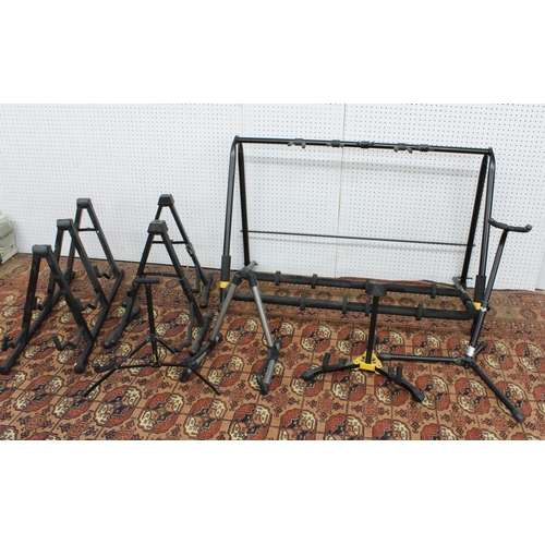 1160 - Hercules five-position folding guitar rack stand; together with seven further guitar stands (8)... 