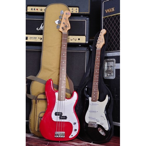 473 - Squier by Fender P bass guitar, red finish, Fender gig bag; together with a Squier by Fender Bullet ... 