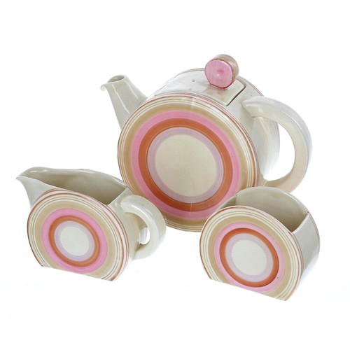 565 - Clarice Cliff Bizarre Bonjour three piece tea set, painted with circular bands in pink and light bro... 