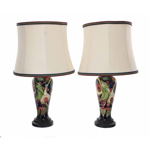 573 - Good pair of Moorcroft Pottery 'Queens Choice' table lamps designed by Emma Bossons, mounted upon tu... 