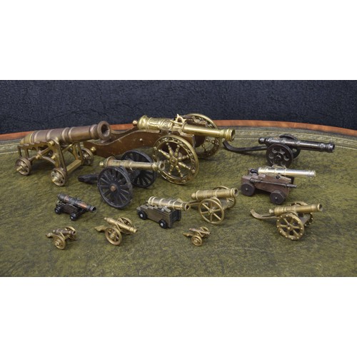 651 - Twelve brass model canons, largest 12