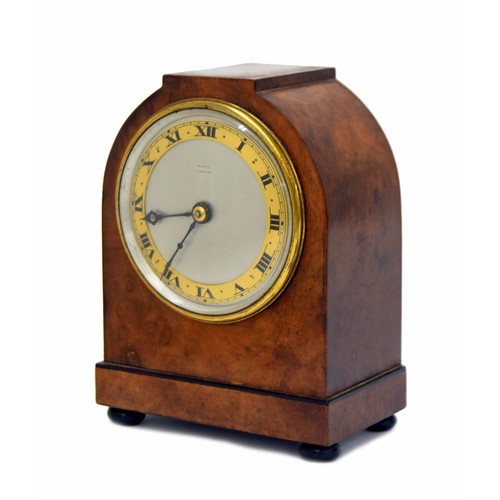 667 - Figured walnut cased small mantel clock signed Maple, London, Roman numeral dial with French platfor... 